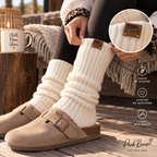 Ivory Peek Breeze leg warmers worn with black leggings and beige clogs in a cabin setting
