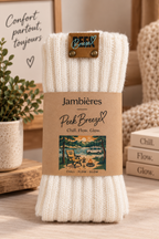 Ivory ribbed leg warmers with packaging and signature patch