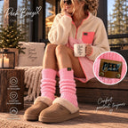 Woman wearing candy pink Peek Breeze leg warmers with a fleece dress and slippers on a patio