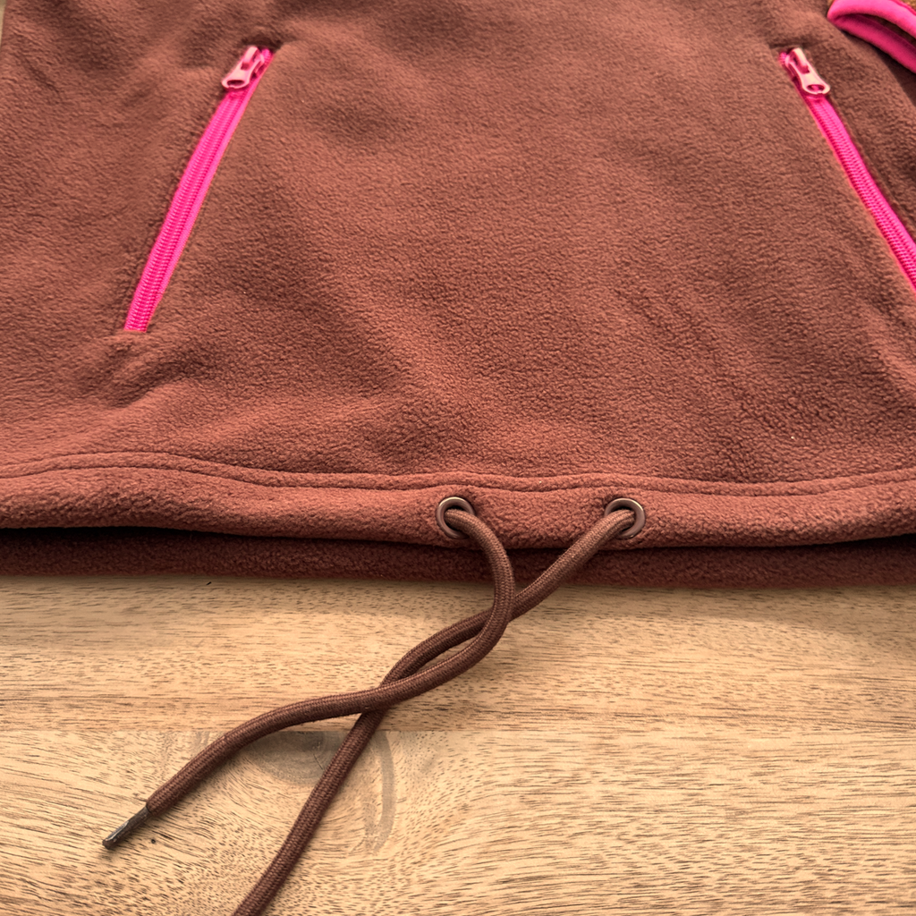 Close-up of the adjustable hem and trim on the Toffee fleece pullover