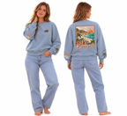 Woman wearing the light blue Coastal crewneck, front and back view