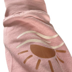 Close-up of the sun and waves print on the Coastal crewneck sleeve