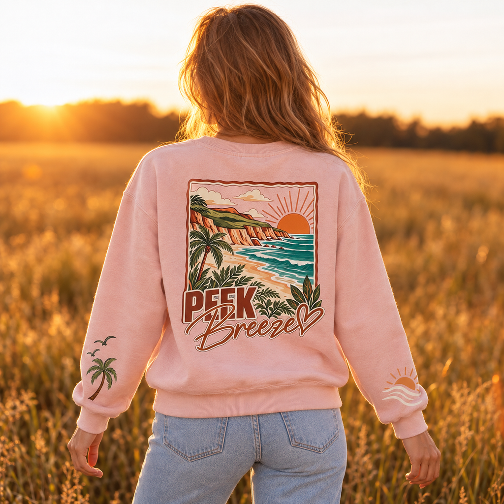Back view of the pale pink Coastal crewneck with a large tropical beach print