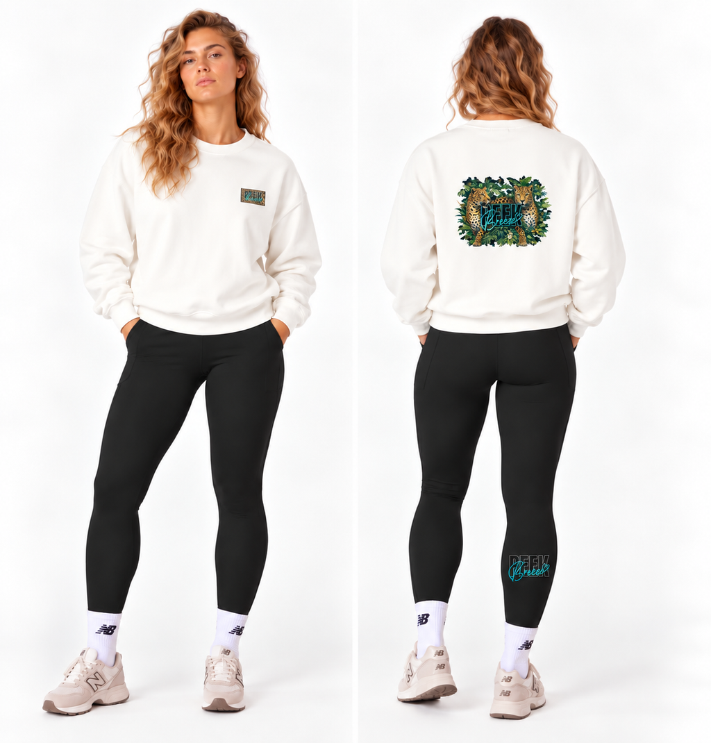 Woman wearing the white WILD crewneck, front and back view, with leopard and leaves print