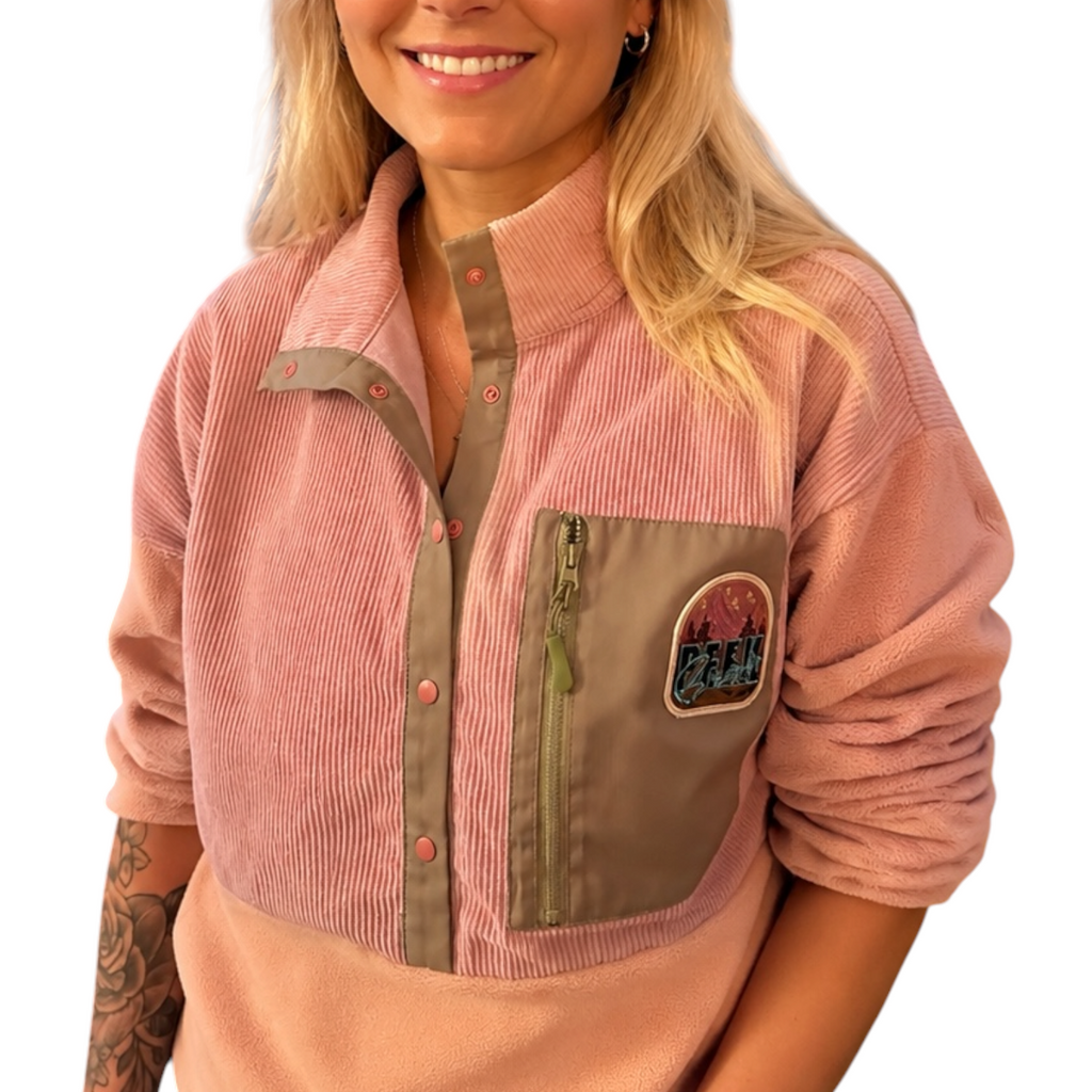 Close-up of the Boreal pink fleece pullover with corduroy chest pocket
