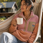 Woman wearing the Boreal pink corduroy fleece pullover at the cabin
