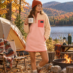 Woman wearing the Peachy sherpa and pink fleece dress at a lakeside campsite in fall