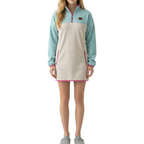 Woman wearing the Breeze fleece and corduroy dress in turquoise, beige and pink