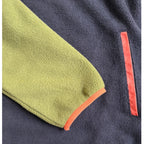 Close-up of the khaki sleeve, navy fleece and coral trim on the Retro dress