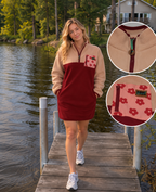 Woman wearing the Rosie burgundy and dusty rose fleece dress with a floral pocket by a lake