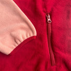 Close-up of the sleeve finish and zippered side pocket on the Rosie fleece dress
