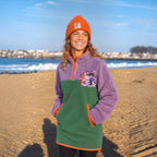 Woman wearing the Aspen lavender and sage green sherpa dress on a beach