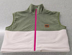 Close-up of the Cedar vest khaki corduroy, ivory fleece and fuchsia zipper